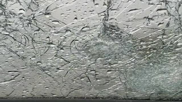 Hail Destroys Driver's Windshield