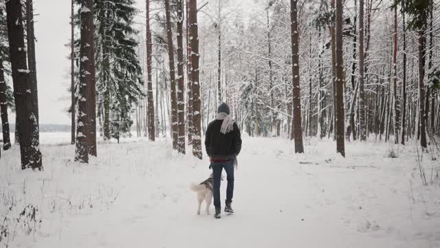 With dog in snow