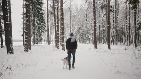 With dog in snow