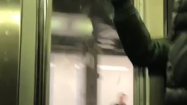 Guy leaves burn marks on subway train ceiling using a lighter