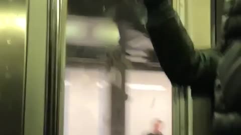 Guy leaves burn marks on subway train ceiling using a lighter