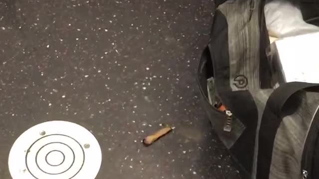 Man on a subway train lighting and smoking a blunt drops it on the floor and picks it back up