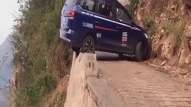 Driving expert U-turn in a very narrow road
