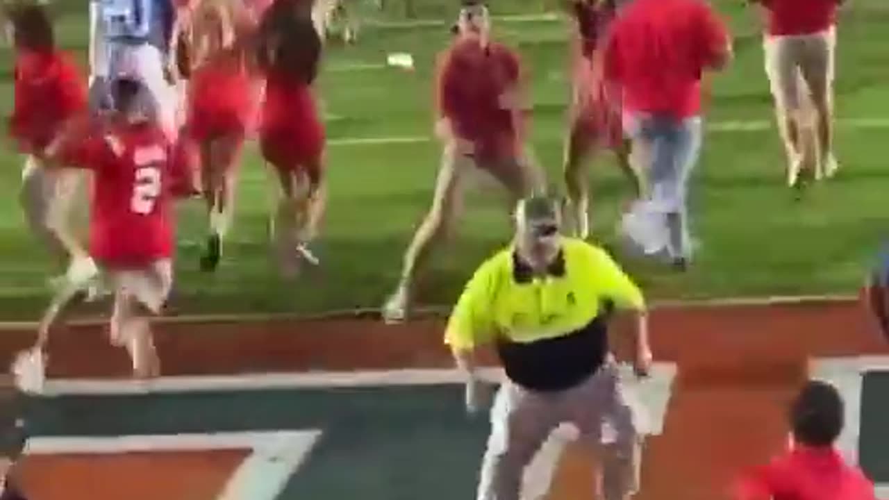 Female Ole Miss fan bulldozed by security while trying to storm field