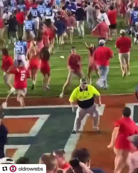 Female Ole Miss fan bulldozed by security while trying to storm field