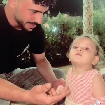 Hamas Terrorist with kidnapped Israeli baby girl in Gaza