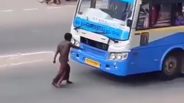 Man showing his alcohol's power on road