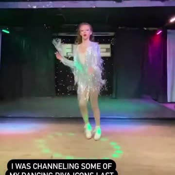 Teen drag queen who identifies as trans performing in a nightclub.