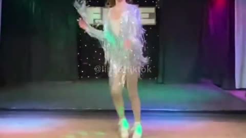 Teen drag queen who identifies as trans performing in a nightclub.