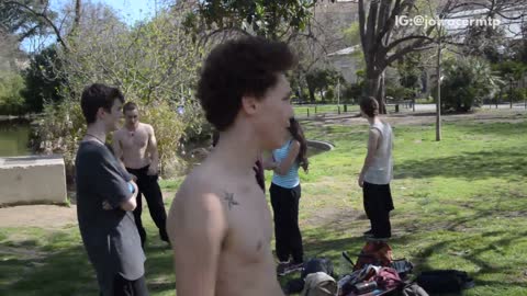 Shirtless curly hair guy tries to run up backflip tree fail