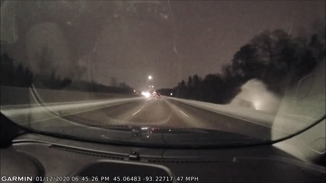 Driver Hits Ice Patch and Rolls Into Ditch