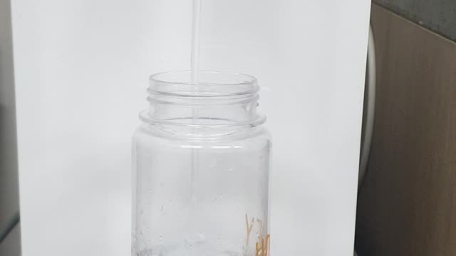 Fill the water bottle with water