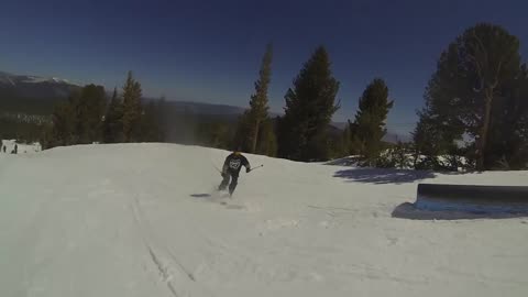 Ski lands backwards one catches