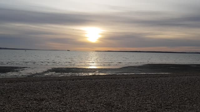 Sun is setting over a calm sea