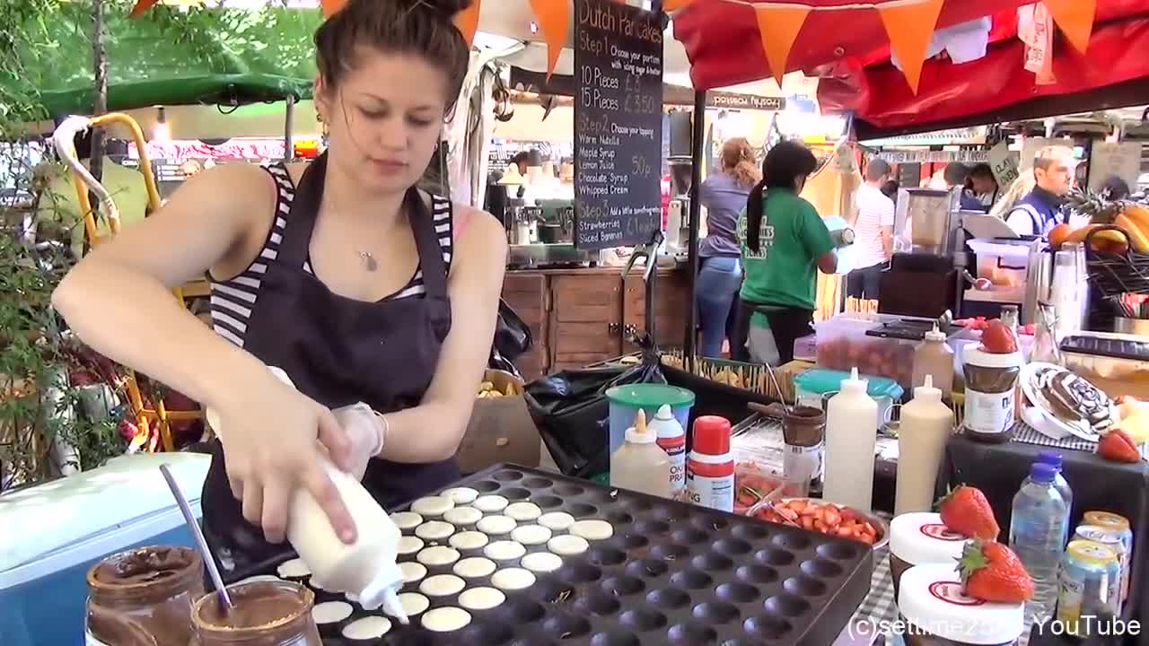 London Street Food. Cooking Sweet Dutch Pancakes _poffertjes_ in Camden Lock Market