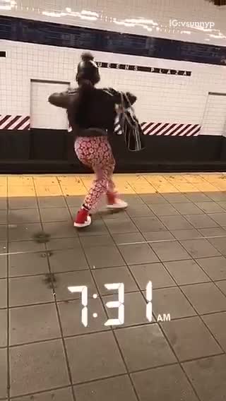 731am girl dancing on subway platform red pants