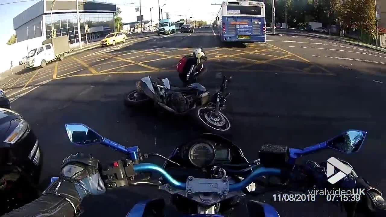 Motorcyclist gets rammed in narrow traffic jam