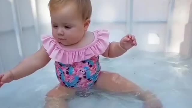 Cute baby girl enjoy pool party