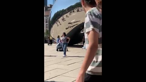 Two drag queens pose for photo-op in front of The Bean in Chicago