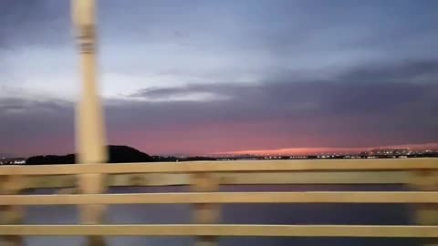 The sunset seen from a running car