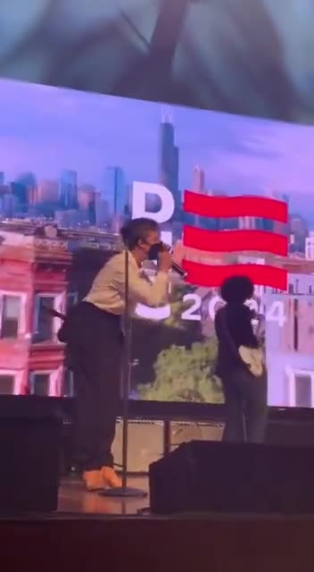 Disruption inside the DNC delegate welcome party on the stage at Navy Pier.