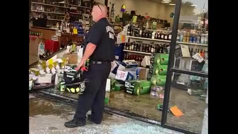 Lady ran into the liquor store, hits a person and cars and drives OFF