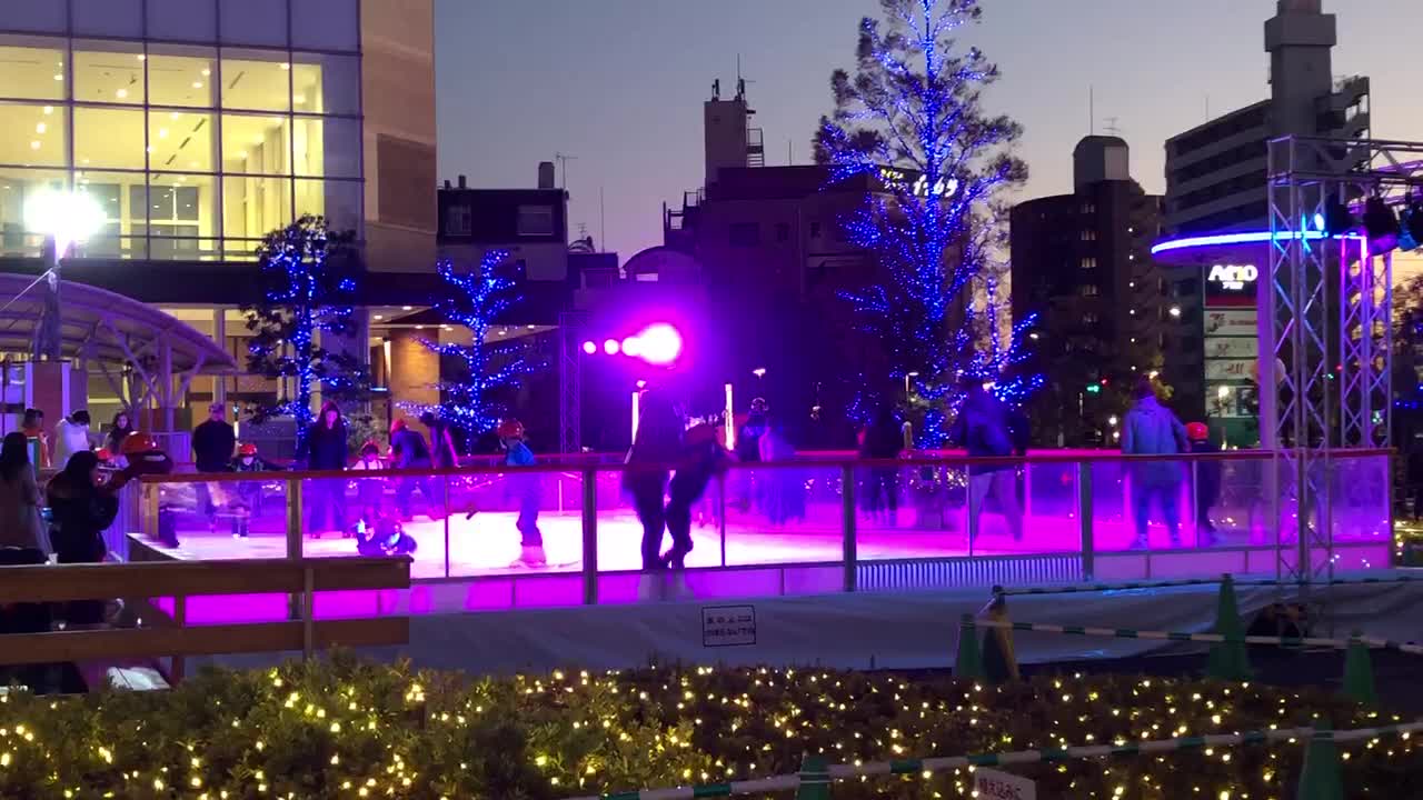 Children ice-skating at night in Japan