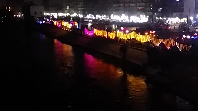 dark river beside city lights amazing view