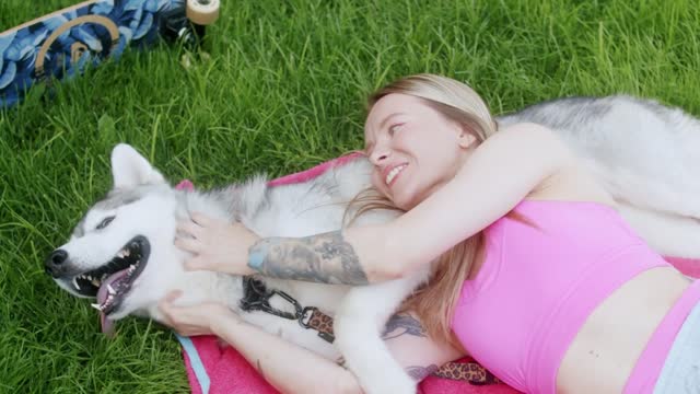 How much dog is at ease while someone is messaging around his neck.