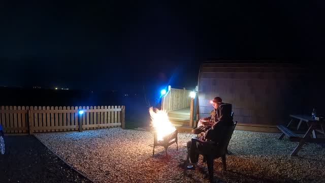 Nightlapse of spending time next to a campfire . At a glamping pod in Cumbria.