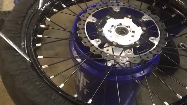 Mounting ice racing tires.