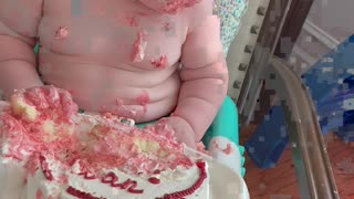 Infant Nods Off During Birthday Cake Feast