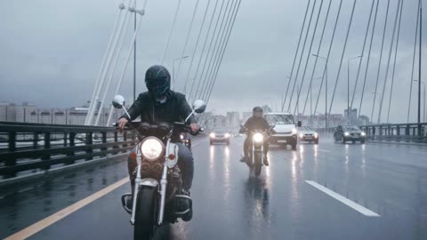 Bikers Riding On Wet Roads On A Rainy Day