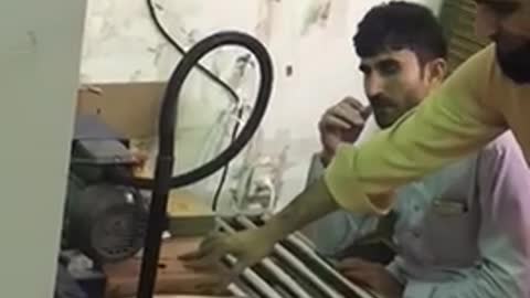 Small cartons tape tapes sealing machine operated in Indian customers factory
