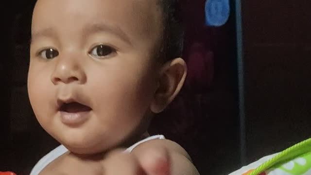 Baby in walker doing funy and smile