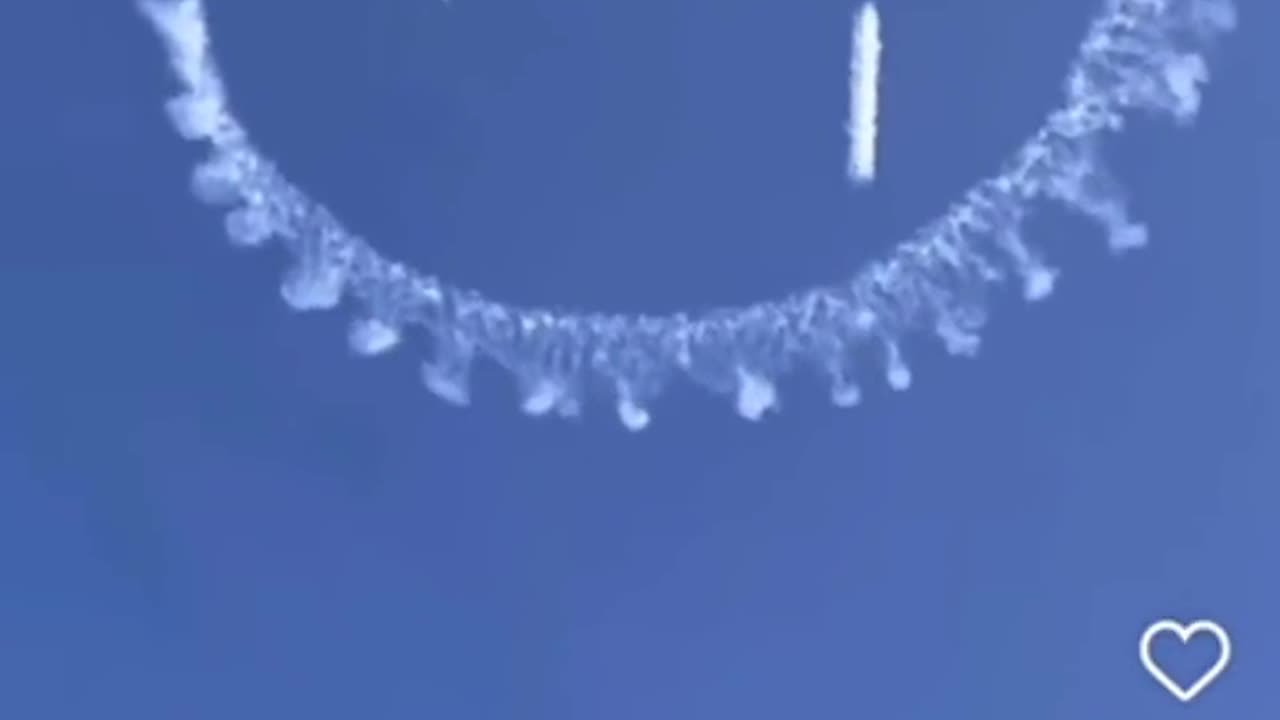 Chemtrails with smiley faces in the air.