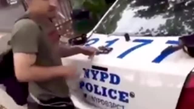 Dealer weighs weed on back of NYPD car