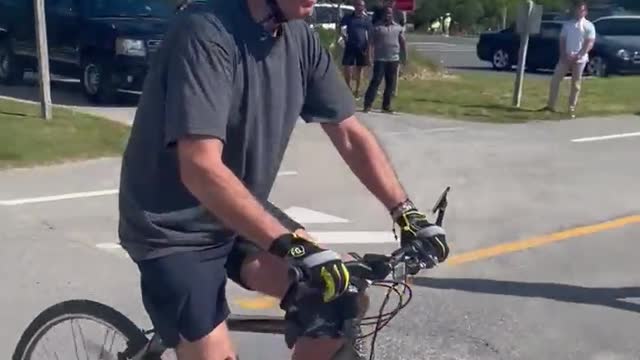 Biden falls off his bike on a Delaware tour with the First Lady. see how the scene went