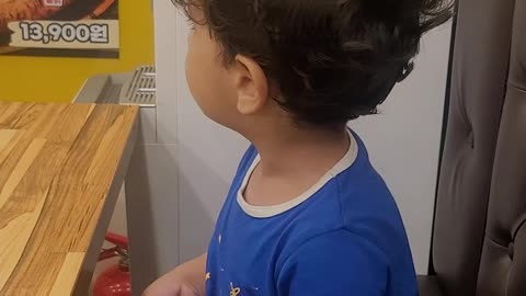 Baby eating pizza