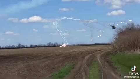 Ukrainian Helicopter flying low firing rockets at the Russian position