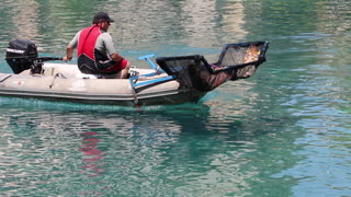 Cleaning the lake in front of the Bellagio in Las Vegas.