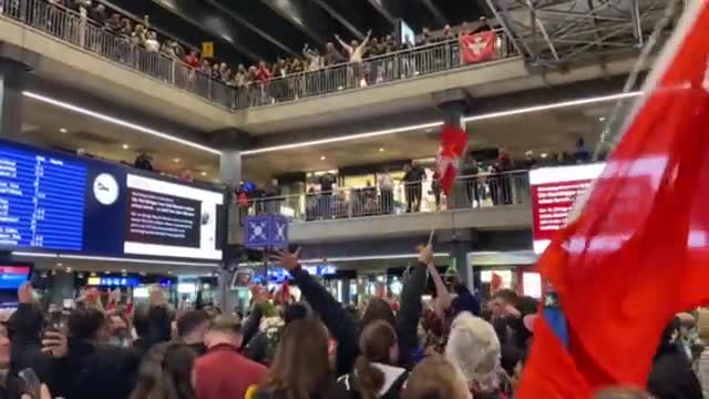 Crowds STORM main railway station in Bern to protest Swiss Covid passport