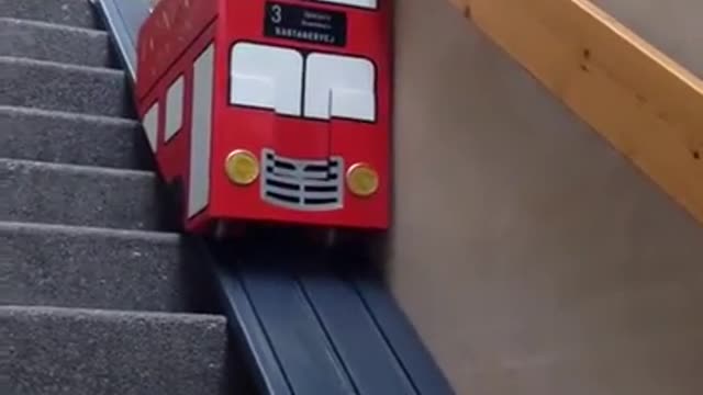 Cute dog takes the London Bus stair lift. Does he have a ticket? very smart he cute puppy