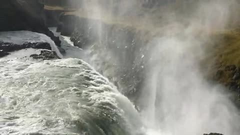 The water springs and descends from the waterfall