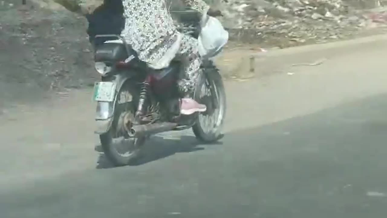 Girl Driving a Bike