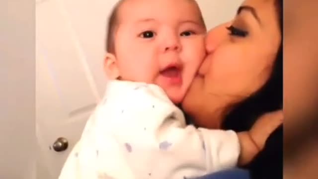 Baby trying to become husband and kiss her mother on lips