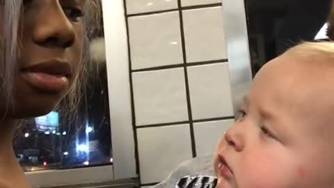 Baby stares at Woman then smirks