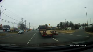 Cut off by dumptruck with flatbed in tow