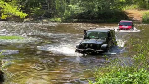 Deep river crossing in the Jeeps while camping in CT