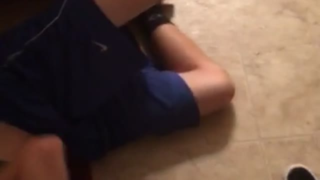 Guy sits on fridge door face plant